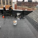 Downtown Malden, Burke Roofs team installing a new flat roof