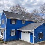 Blue siding & asphalt shingles